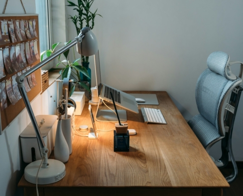 grey desk lamp on top of office desk